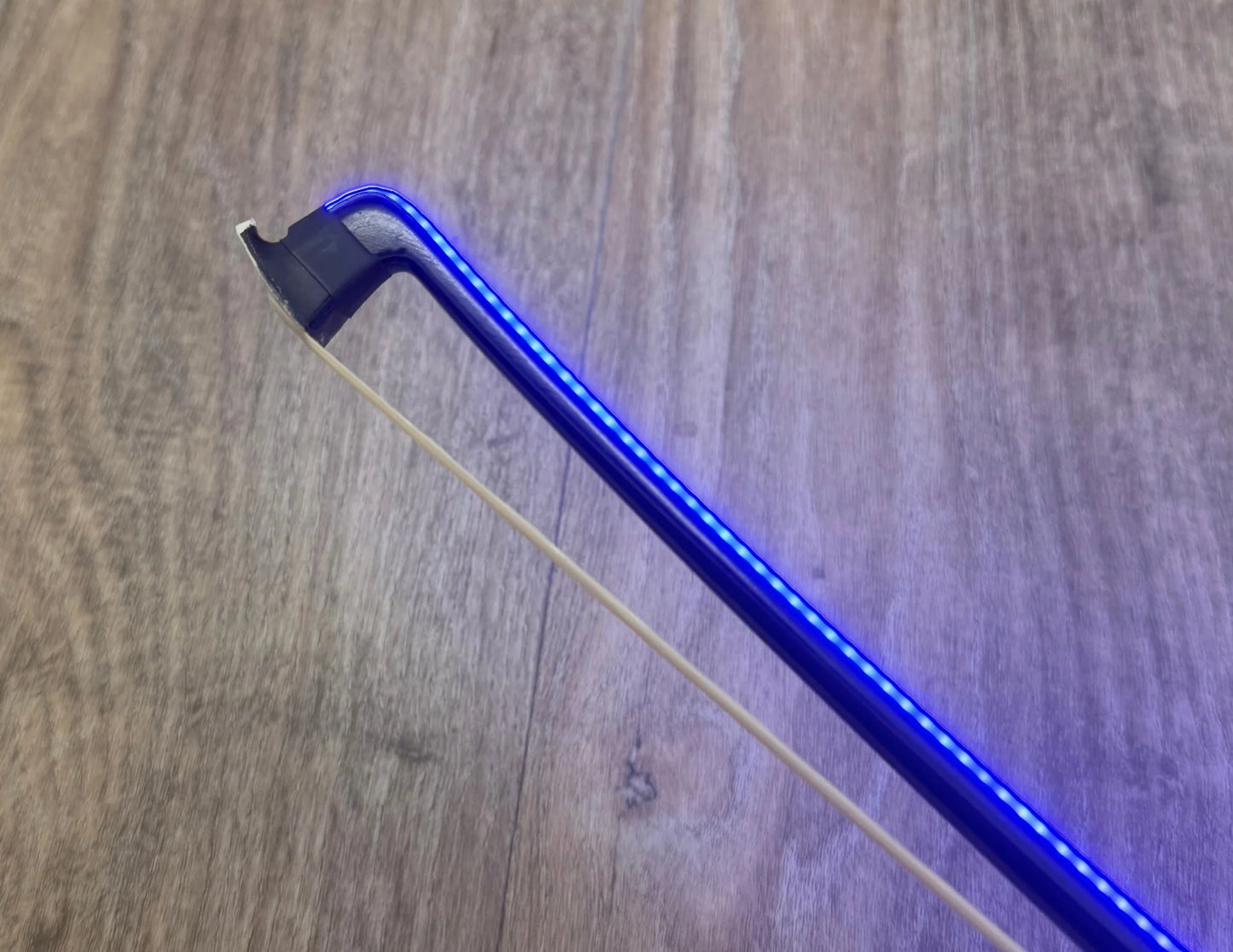 Blue LED BOW on a wooden surface
