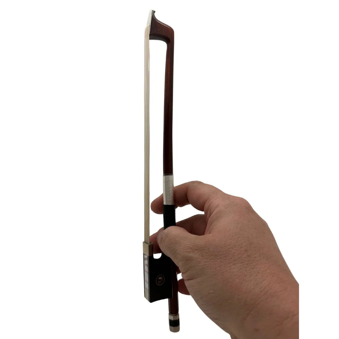 Hand holding a violin bow on a white background