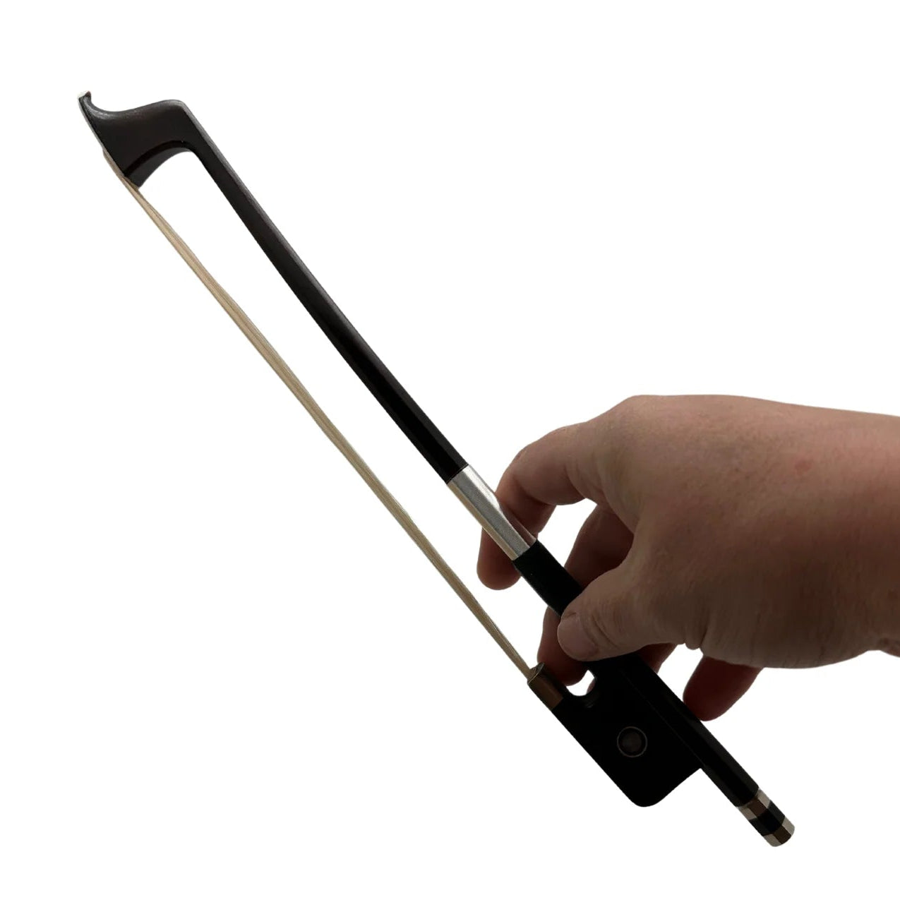 Hand holding a black and silver lamp on a white background